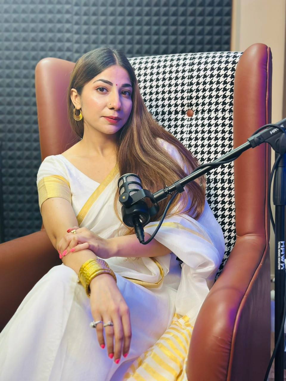 Neha speaking on mic